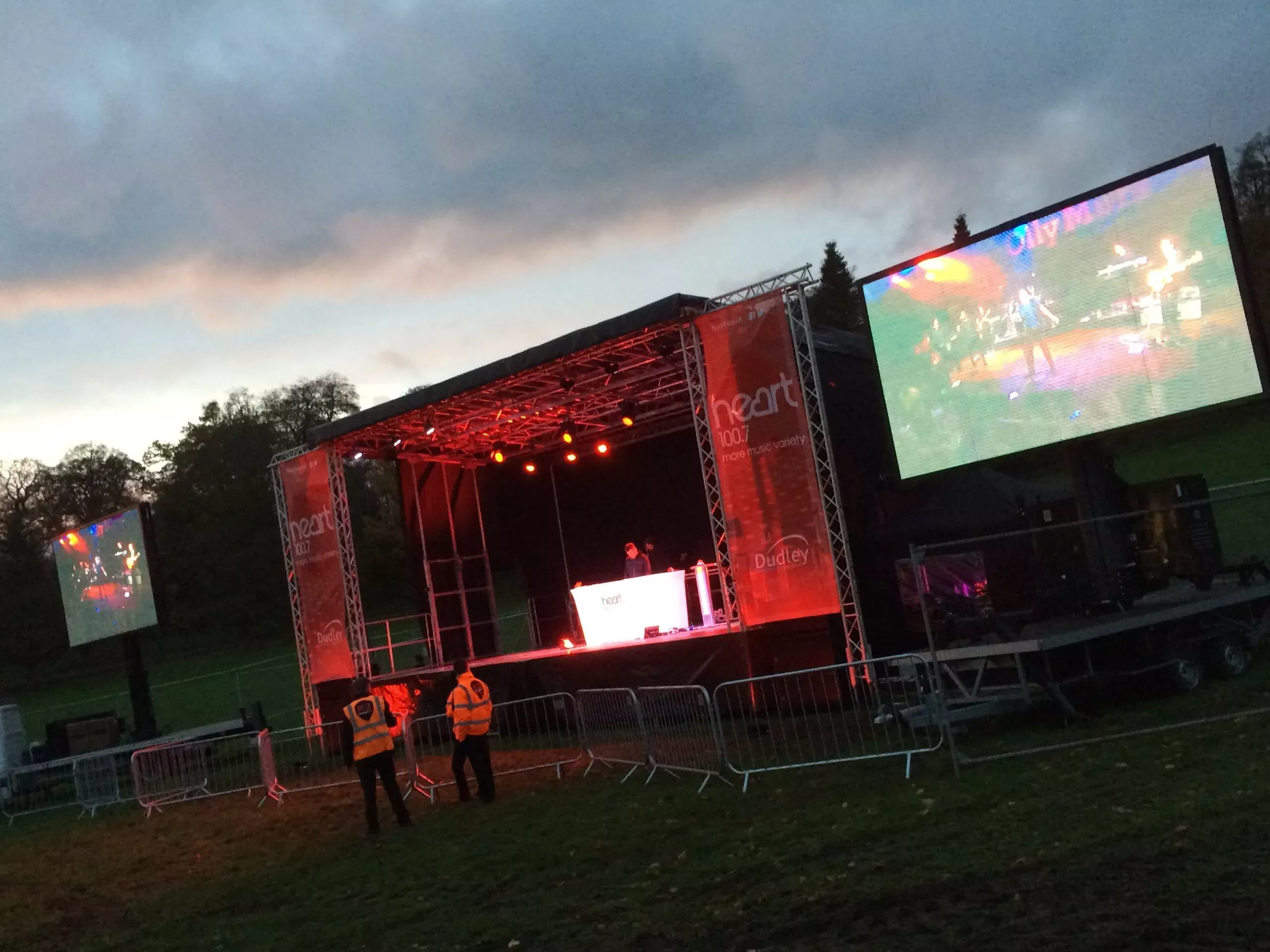 EEH stage lit at dusk with a mobile LED screen alongside